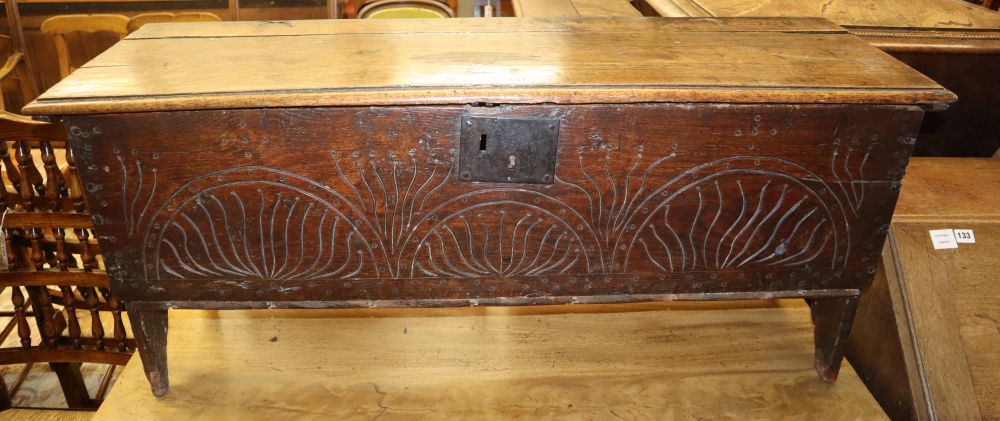 A late 17th century and later oak six plank coffer, on shaped end supports, W.112cm, D.36cm, H.50cm